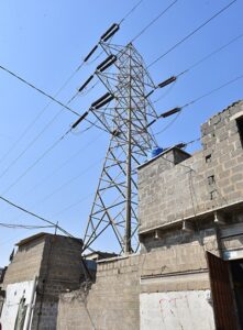 Future Colony located in Landhi encroaches under Extra High Tension electricity infrastructure creating a publlic safety hazard. | KESC from Narratives Magazine